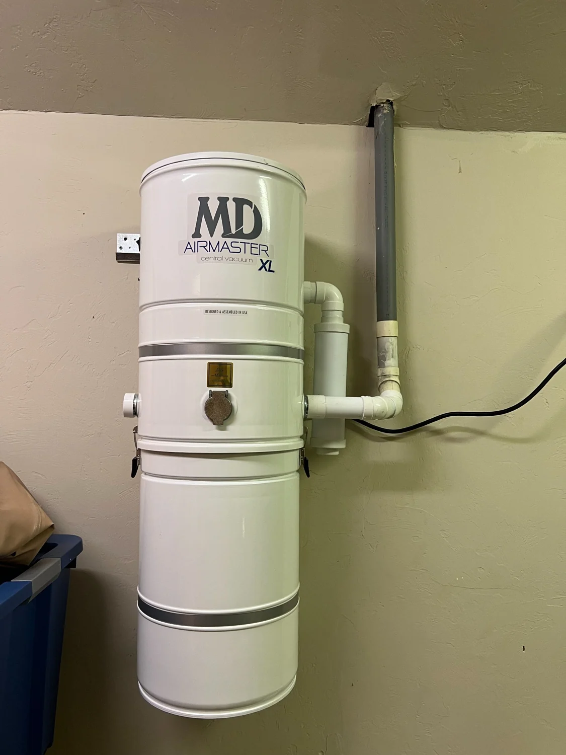 An installed replacement central vacuum power unit.